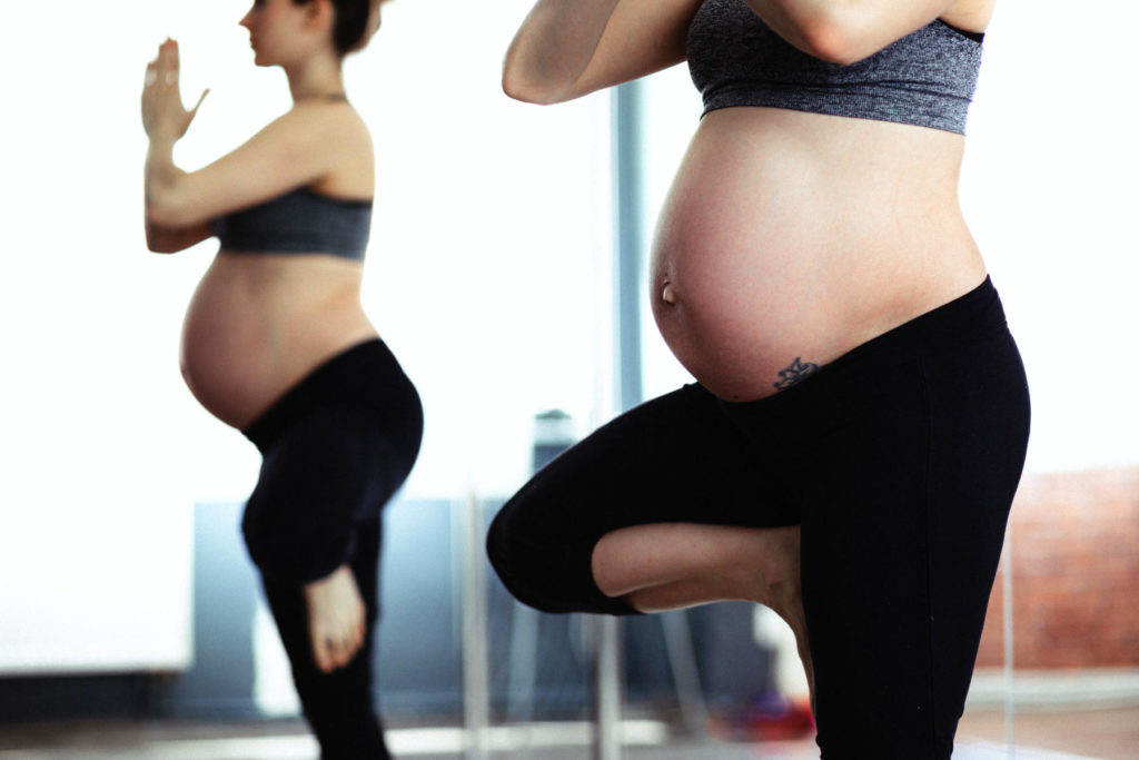 Pregnant woman doing Yoga